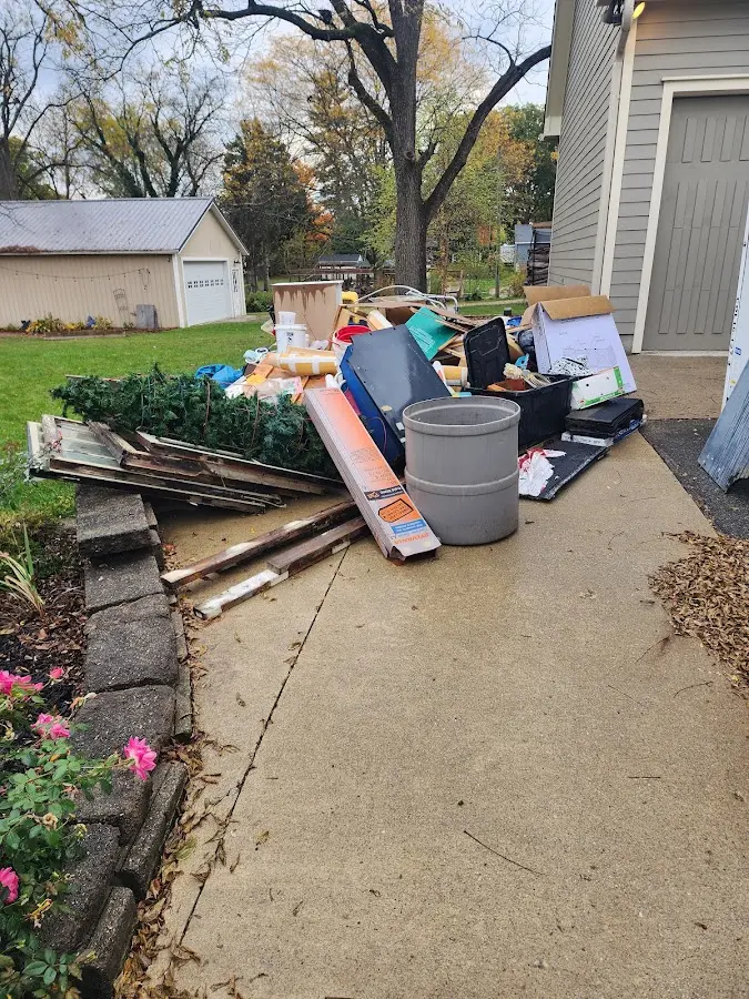 Dumpster being loaded with debris for 3 Yard Dumpster Rental in North Berwick